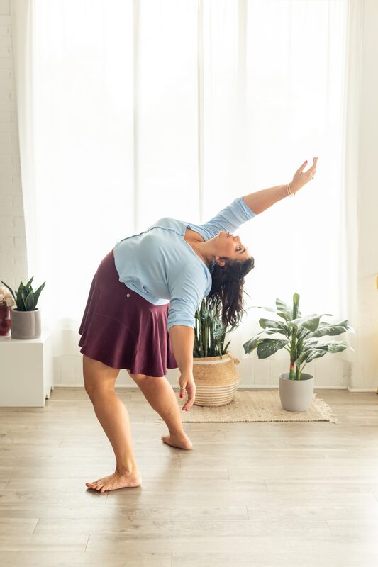 Alexandria mid-swing, back arched, arms lifted
