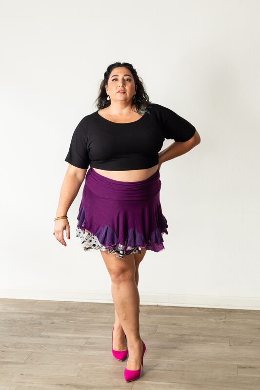 Alexandria standing poised, magenta heels